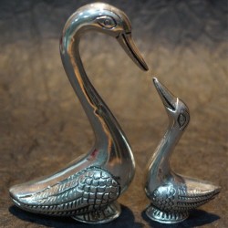 Aluminium duck with its duckling idols