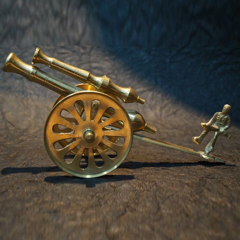 Beautiful Brass Cannon with a man 