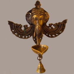 Brass deepa with Ganesha face wall hanging