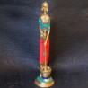Traditional brass tribal woman figurines with coral dress on top