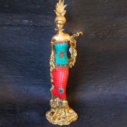 Traditional brass tribal woman figurines with coral dress on top