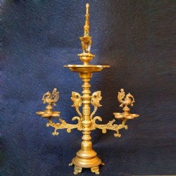 Traditional brass deepa with peacocks on both sides